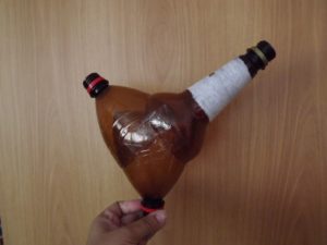 Cock from plastic bottles and disposable tableware 3