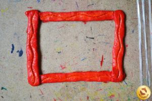 Frame made of salt dough with your hands 16